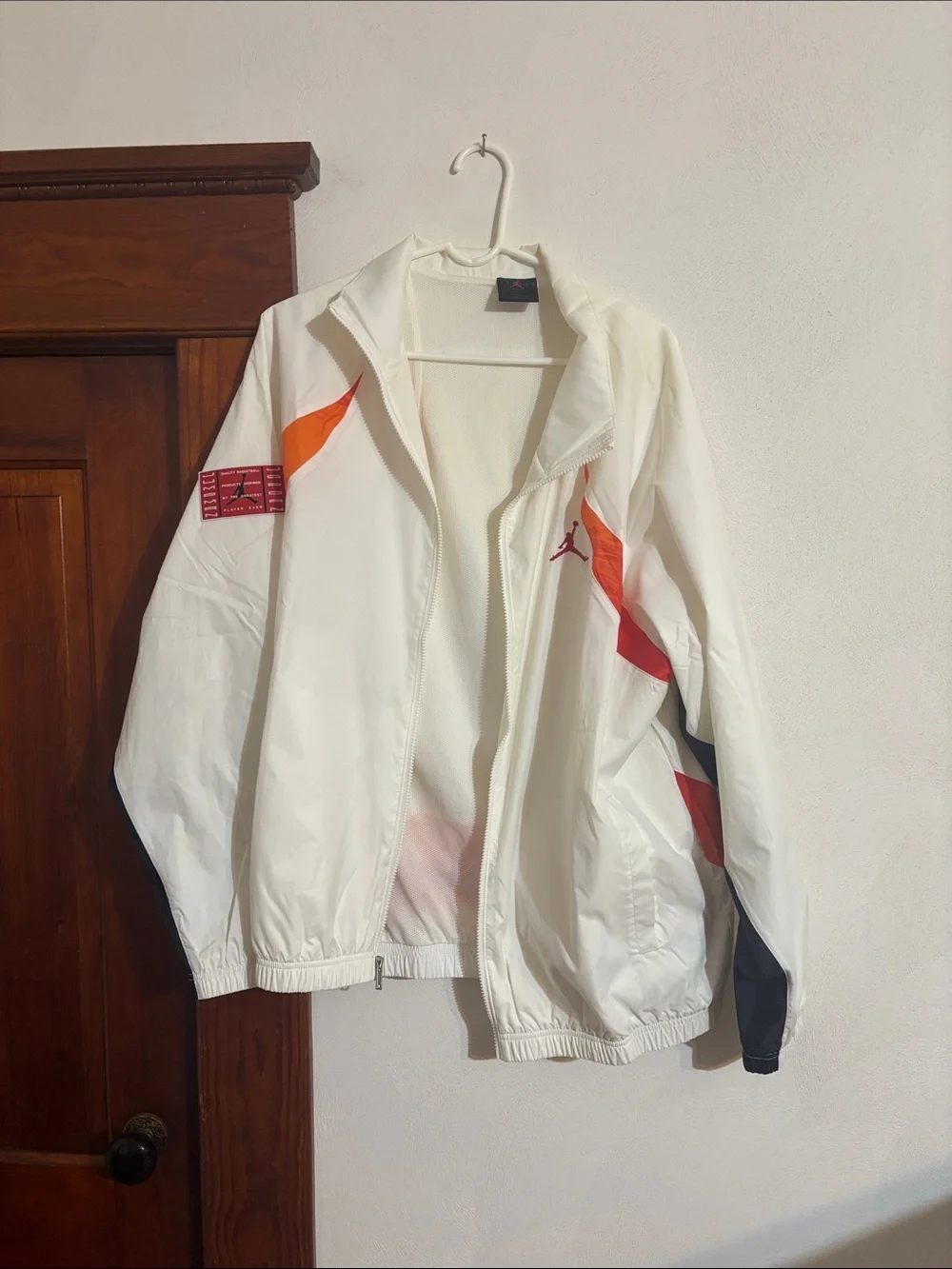Jordan White Windbreaker with Orange and Red Accents